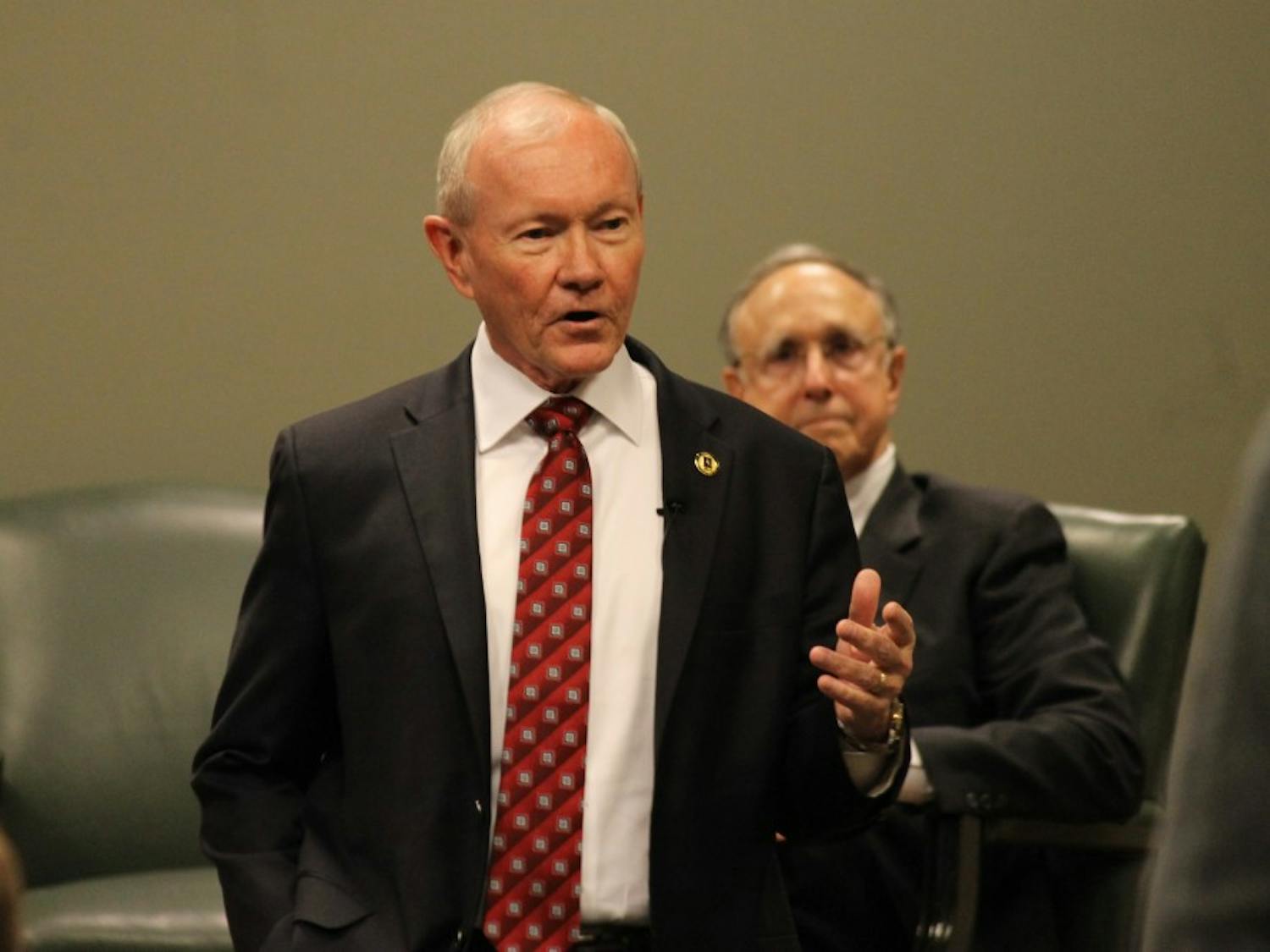 General Martin Dempsey, former Chairman of the U.S. Joint Chiefs of Staff, discusses U.S. national security at a forum with Professor Richard Kohn and Professor Klaus Larres on Tuesday evening in Wilson Library.