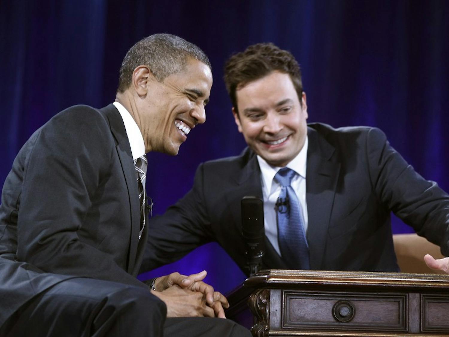 President Barack Obama  laughs as he tapes an appearance on the Jimmy Fallon show at Memorial Hall on the  UNC campus in Chapel Hill, N.C. Tuesday April 24, 2012. POOL PHOTO/CHUCK LIDDY/ THE NEWS & OBSERVER