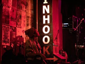 Essi Novelli, a 20-year-old singer from Raleigh, watches a performance at the Pinhook on Dec. 2, 2019.