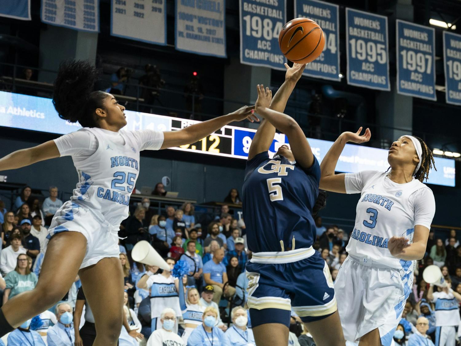 UNC junior guard Deja Kelly (25) and junior guard Kennedy Todd-Williams (3) defend the basket during a basketball game against Georgia Tech on Sunday, Jan. 22, 2023, in Carmichael Arena. UNC won 70-57.