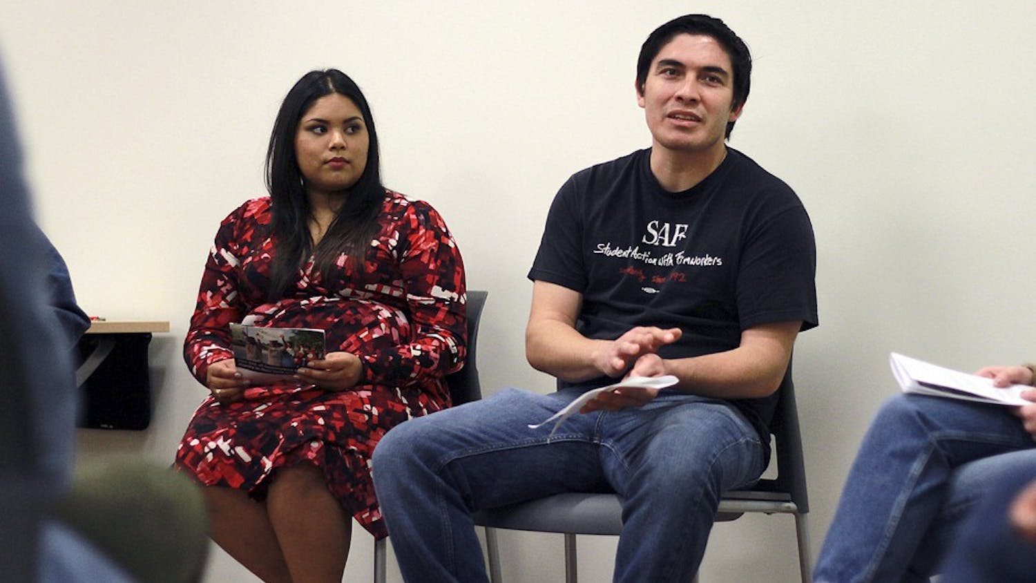 Jazmin Posas (left) and Ramon Zepeda of Student Action with Farmworkers joined UNC student organization FLO (fair, local, organic) to host a film screening and Thanksgiving potluck on Monday evening.