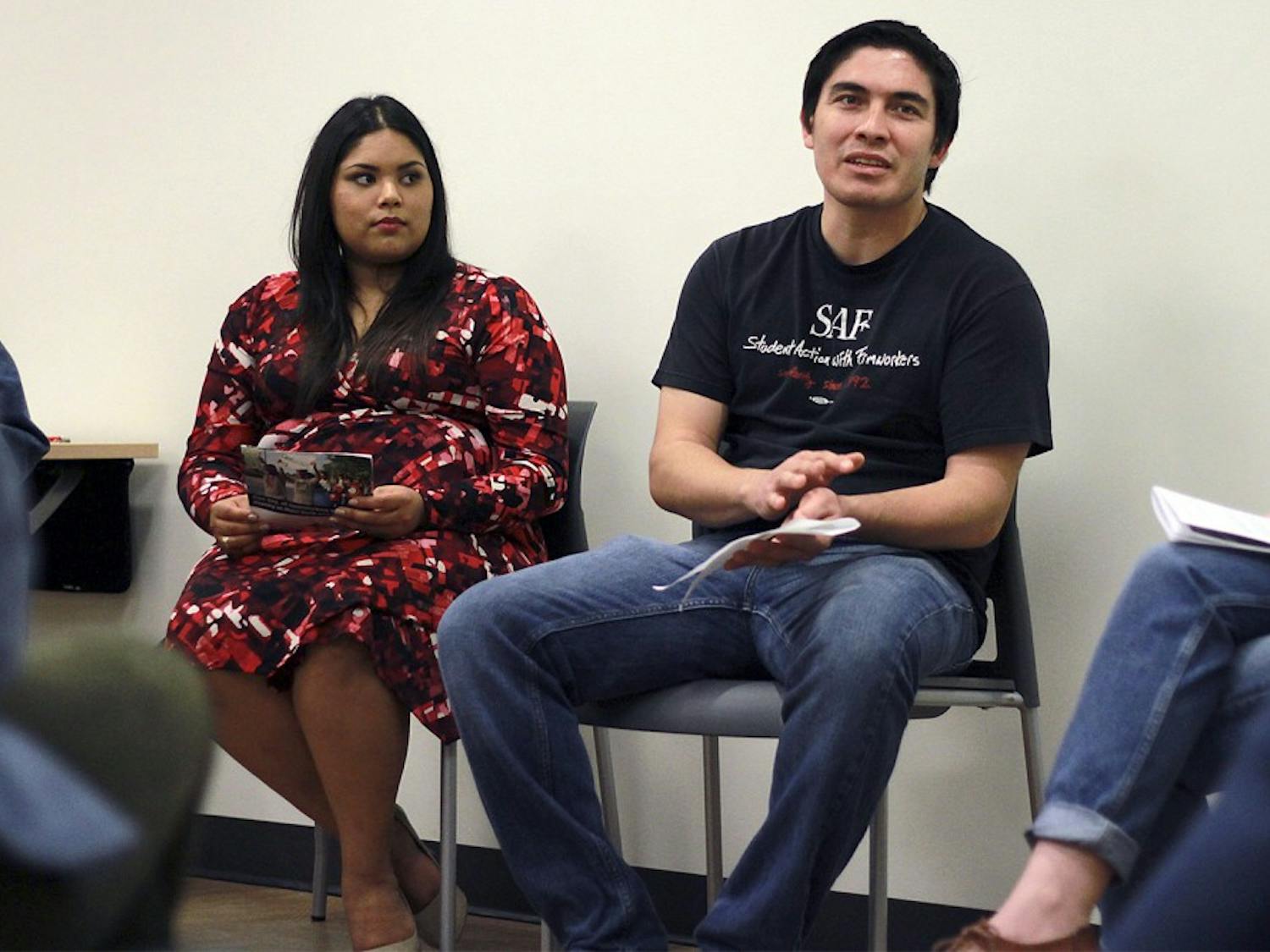 Jazmin Posas (left) and Ramon Zepeda of Student Action with Farmworkers joined UNC student organization FLO (fair, local, organic) to host a film screening and Thanksgiving potluck on Monday evening.