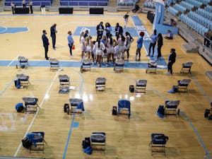 The UNC team huddles in Carmichael Arena on Jan. 14, 2021 in Chapel Hill, N.C. The Tar Heels lost to the Hokies 66-54.
