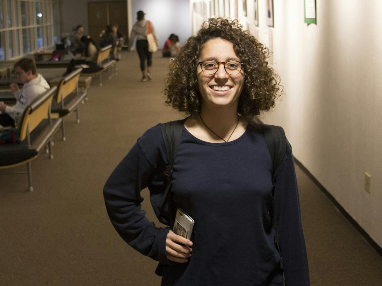 First-year Biology major Lora Razzon poses for a portrait in the union.