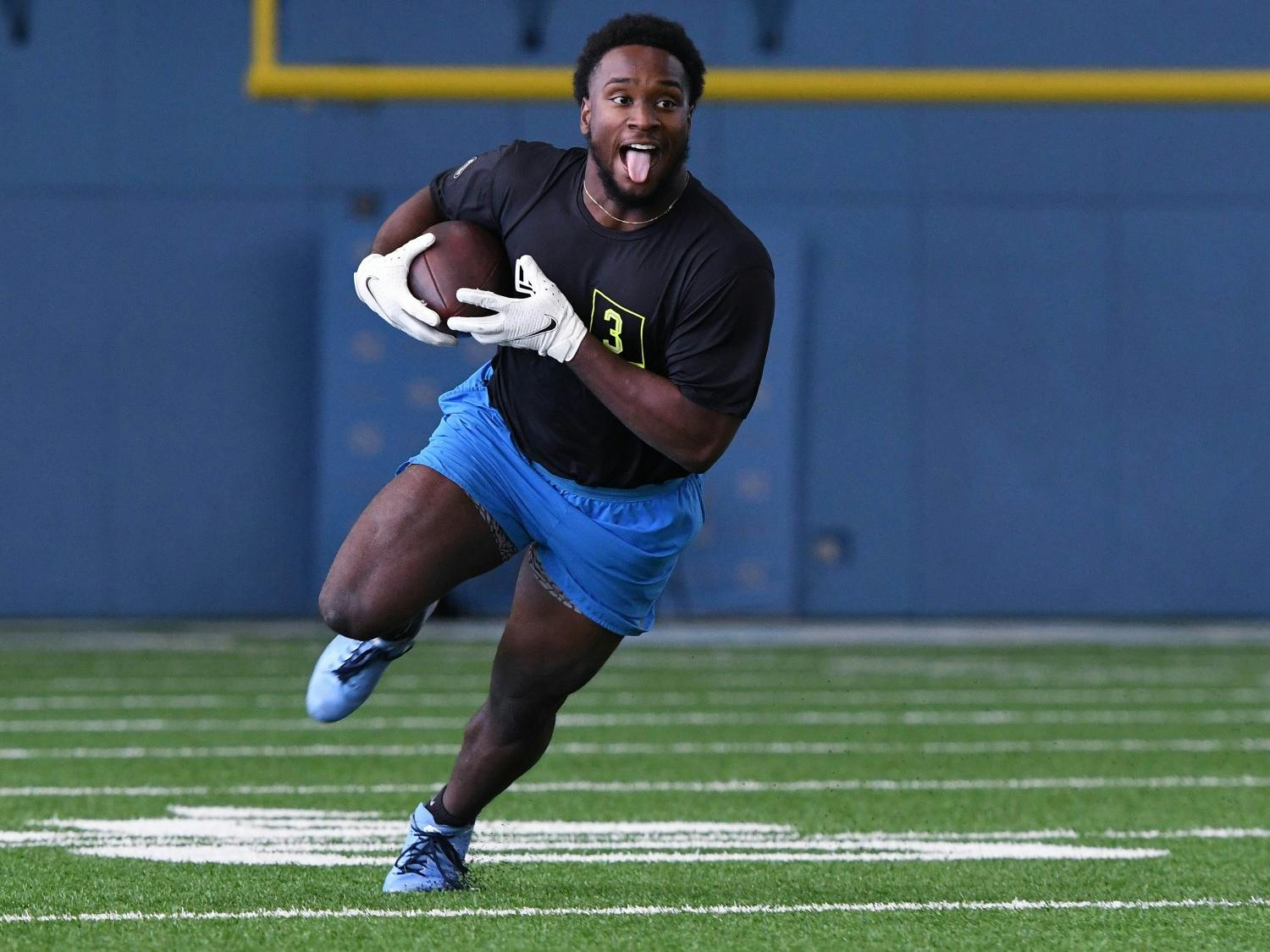 Michael Carter runs drills during University of North Carolina Football Pro Day at the Indoor Practice Facility on Monday, March 29, 2021. Photo courtesy of Jeff Camarati. 
