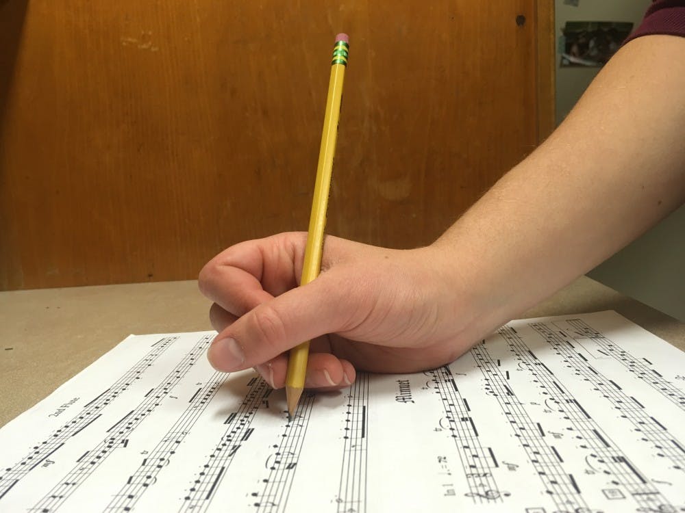 <p>Sophomore Barbara Ramsdell writes on sheet music in Avery Residence Hall on Sunday, April 8, 2018. Photo courtesy of &nbsp;Annie Bennett.</p>