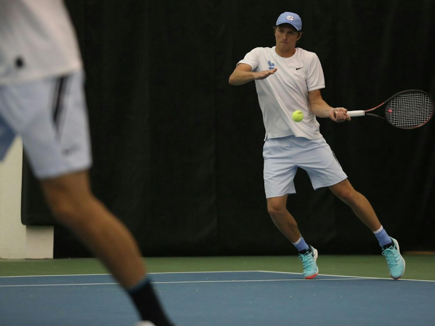 UNC men's tennis first-year Brian Cernoch returns the ball during a doubles match against Boston College on Friday April 5, 2019. UNC defeated Boston College 5-1.