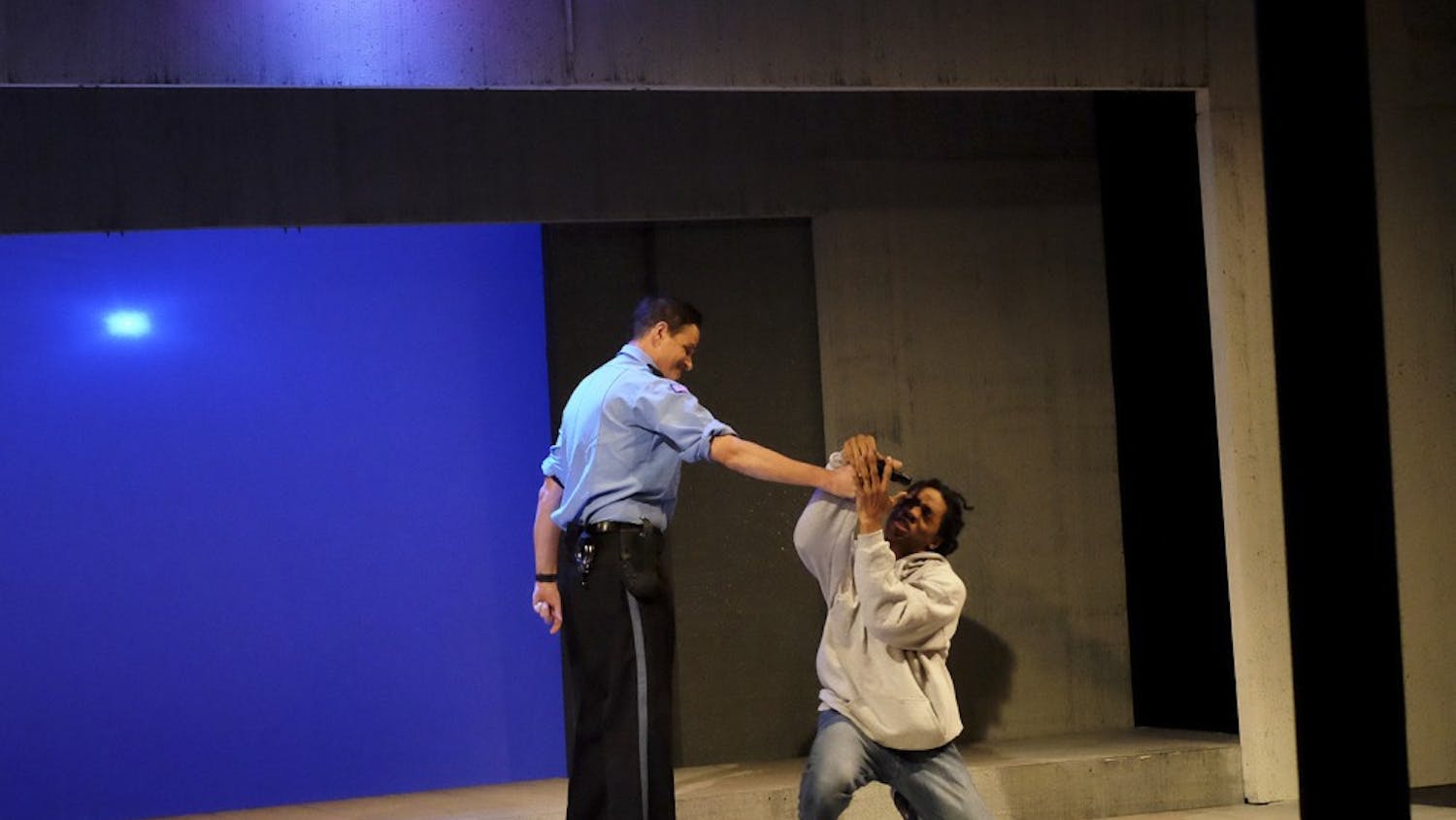 John Allore (left) and Alexander Jackson fight for control of a situation during "Stop/Frisk" by Rich Rubin.