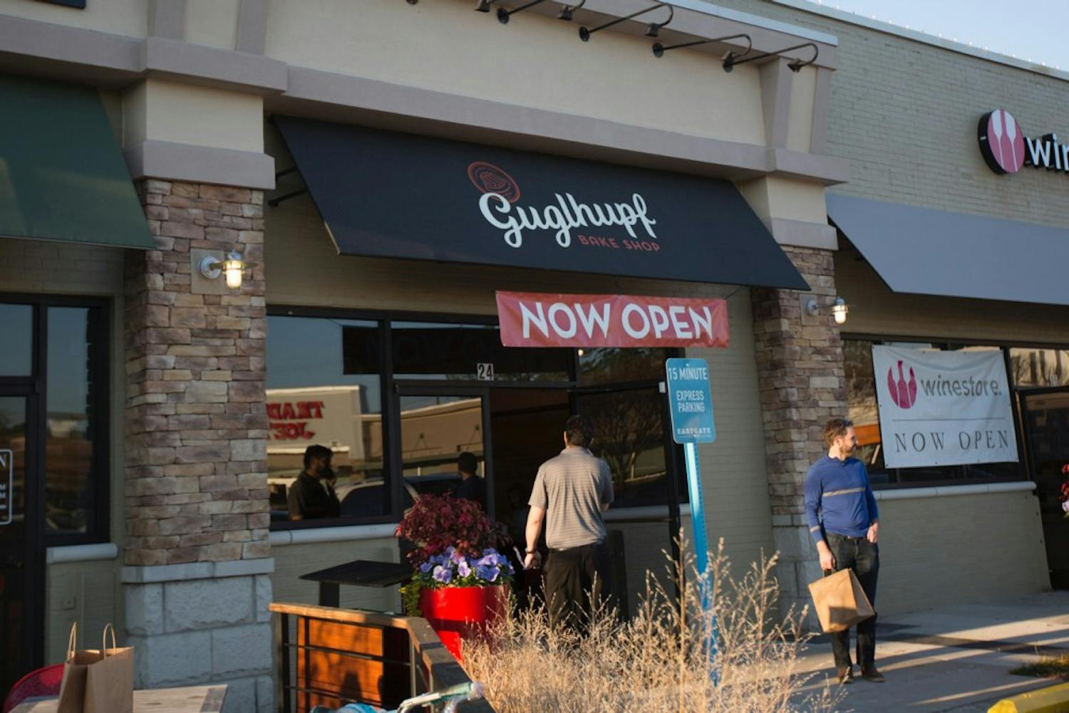 Customers walk in and out of the newest bakery in the Eastgate shopping center, Guglhupf, on Friday, Dec. 1.&nbsp;
