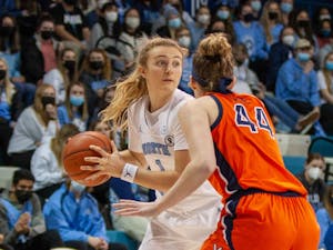UNC sophomore guard Alyssa Utsby (1) prepares to pass the ball at the game against Virginia at Carmichael Arena on Jan. 20 2022. The Tar Heels' beat the Cavliers 61-52.