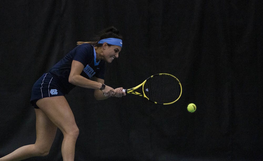 UNC senior Alexa Graham swings at her opponent's serve on Sunday, Feb. 2, 2020. Graham won her first set 6-4, and 6-2 in the second set. UNC beat Vanderbilt 7-0 overall. 