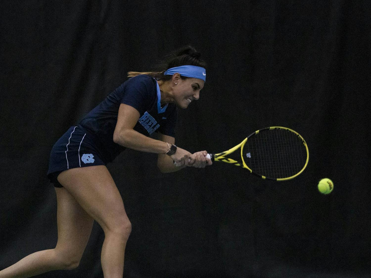 UNC senior Alexa Graham swings at her opponent's serve on Sunday, Feb. 2, 2020. Graham won her first set 6-4, and 6-2 in the second set. UNC beat Vanderbilt 7-0 overall. 
