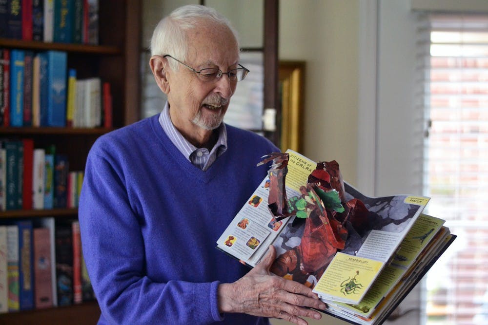 Retired UNC professor Sterling Hennis displays his collection of pop-up books on Tuesday, Nov. 3. He recently donated 1600 of his books to Wilson Library on campus.