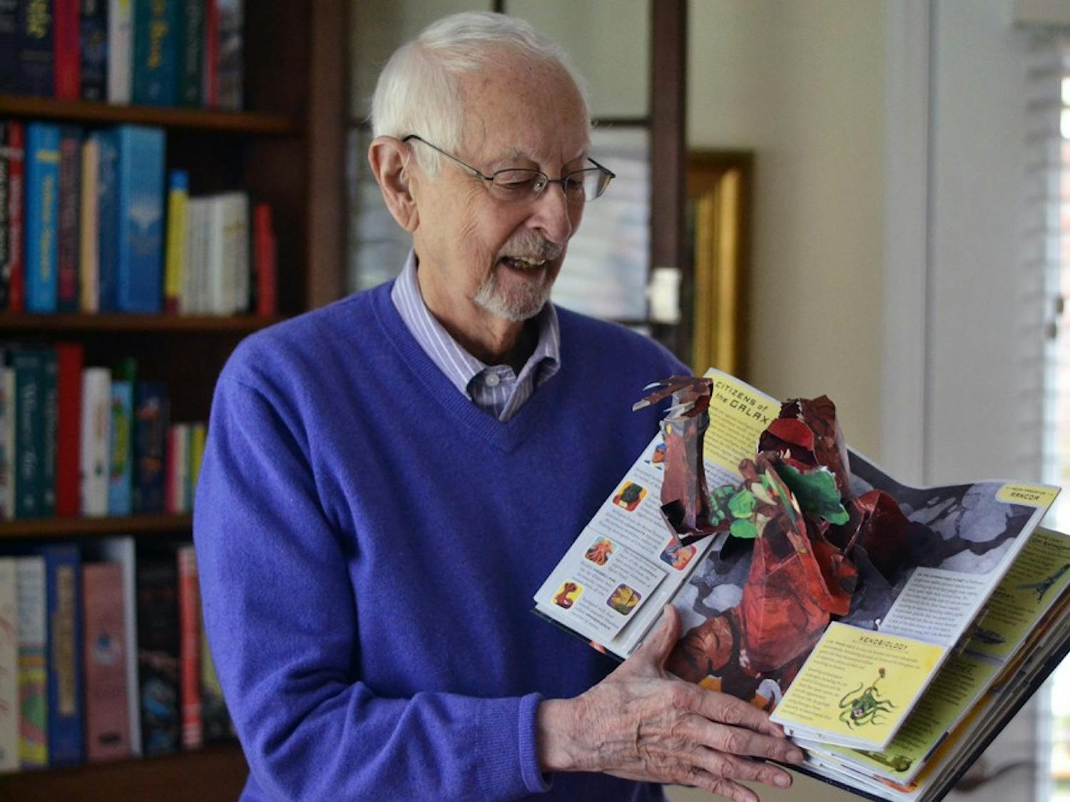 Retired UNC professor Sterling Hennis displays his collection of pop-up books on Tuesday, Nov. 3. He recently donated 1600 of his books to Wilson Library on campus.