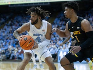 Sophomore guard RJ Davis (4) looks for a teammate to pass the ball to at the game against Appalachian State on December 21, 2021 at the Dean E. Smith Center. UNC won 70-50.