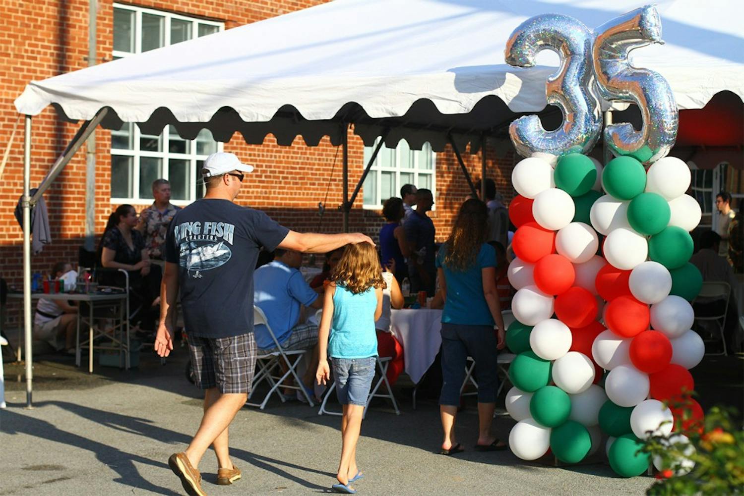 Students and members of the Chapel Hill community meet across the street from IP3 on Franklin Street. The block party celebrated 35 years of pizza.