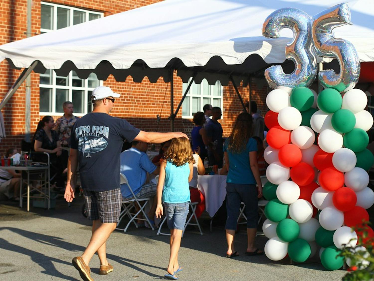 Students and members of the Chapel Hill community meet across the street from IP3 on Franklin Street. The block party celebrated 35 years of pizza.