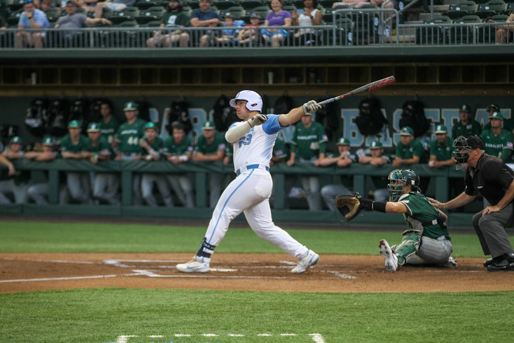 UNC sophomore first basemen and designated hitter Alberto Osuna (23) hits the ball during the baseball game against Charlotte on Tues. May 3, 2022 at Boshamer Stadium. UNC beat Charlotte 4-3.