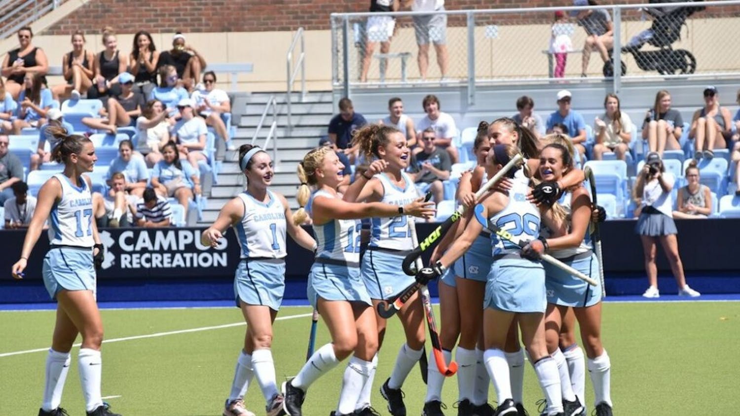 The North Carolina field hockey team celebrates during its 5-1 win against No. 5 Michigan on Aug. 25 at Carolina Field Hockey Stadium.