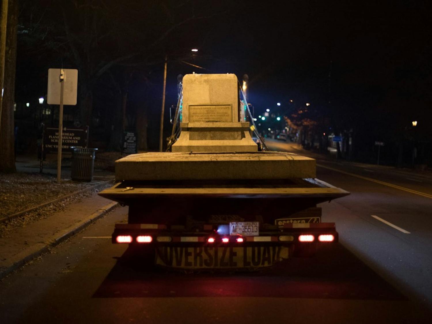 Workers remove the base of Silent Sam, which stood on the campus of UNC-CH for over 100 years, the night of Tuesday, Jan. 14, 2019. The removal of the pedestal came hours after Chancellor Carol Folt announced the removal and her resignation after spring graduation.