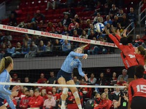 UNC's outside hitter Skylar Wine (6) spikes the ball during the game at N.C. State on Wednesday, Nov. 14. UNC lost to State 3-0. 