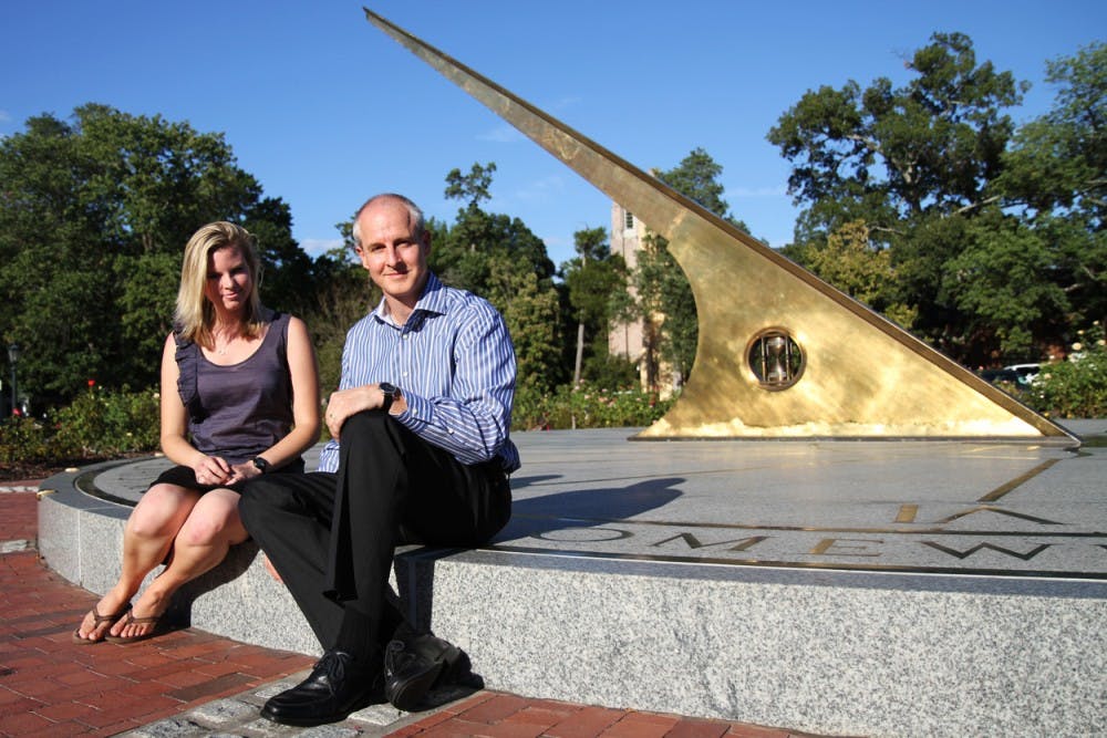 “Spotlight Solar designs an art form intended to be visually appealing on the ground, among the people, versus on the roof,” said Craig Merrigan, CEO of Spotlight Solar, sitting with one of his two UNC interns, Jessica Bruckert. The company’s mission is to raise awareness for solar energy.