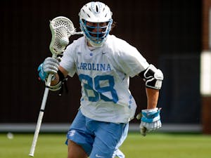 UNC sophomore defensive midfielder Alex Breschi (88) goes on the attack during an 18-16 loss to UVA at Dorrance Field on April 10, 2021.