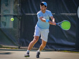 UNC freshman Logan Zapp returns the ball with a backhand shot during the Tar Heels' 4-3 victory over Miami on Friday, April 16, 2021. Zapp finished the afternoon with two set victories, 6-3, and 6-4.