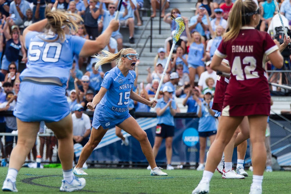 <p>Fifth-year attacker Scottie Rose Growney (15) celebrates after scoring a goal during UNC’s NCAA national championship game against Boston College at Homewood Field in Baltimore, Md. on May 29, 2022. UNC won 12-11.</p>