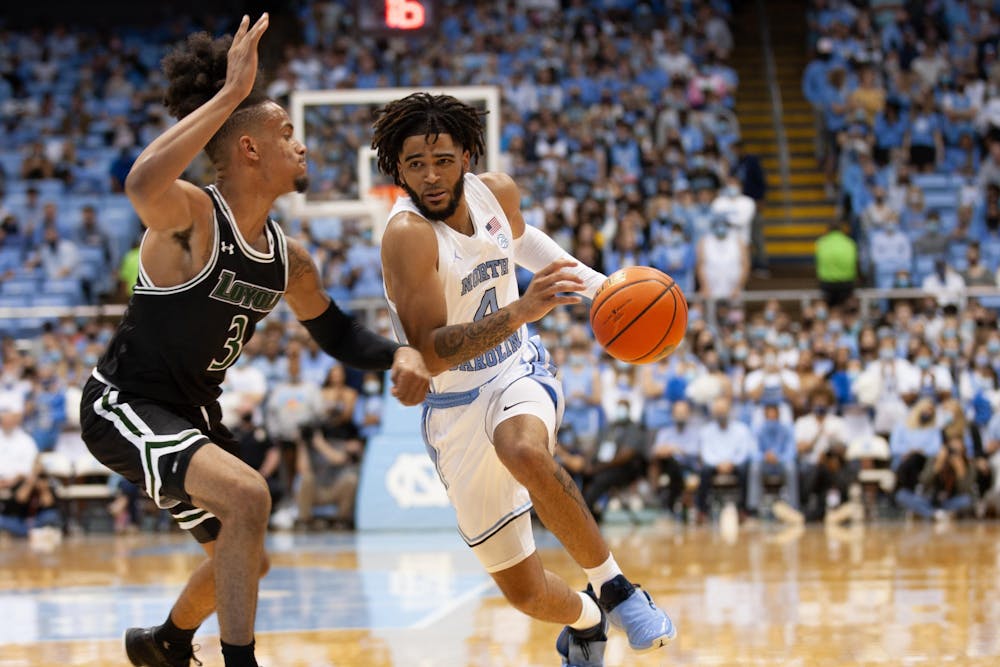 UNC sophomore guard RJ Davis drives the ball towards the basket during the Tar Heel's game against Loyola on Nov. 9, 2021 at the Dean E. Smith Center.