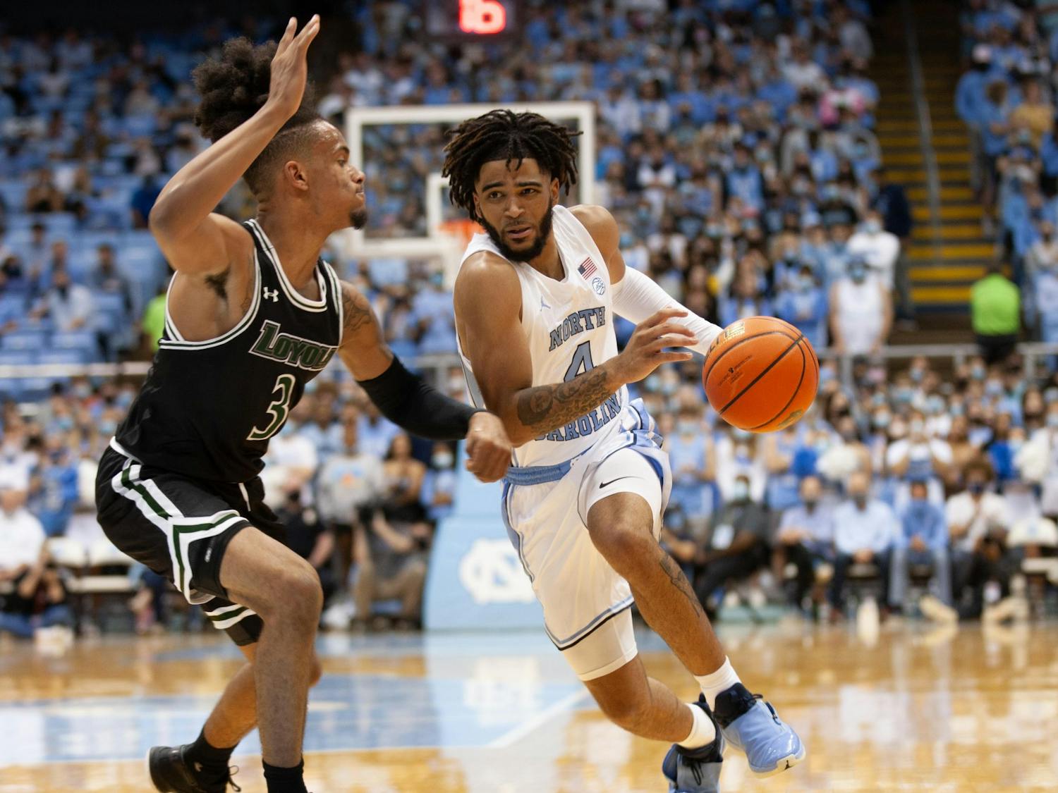 UNC sophomore guard RJ Davis drives the ball towards the basket during the Tar Heel's game against Loyola on Nov. 9, 2021 at the Dean E. Smith Center.