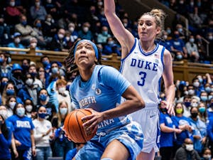 Sophomore guard Kennedy Todd-Williams (3) beats defender and prepares to finish the layup in Cameron Indoor Stadium on Thursday, Jan. 17, 2022. UNC won 78-62.