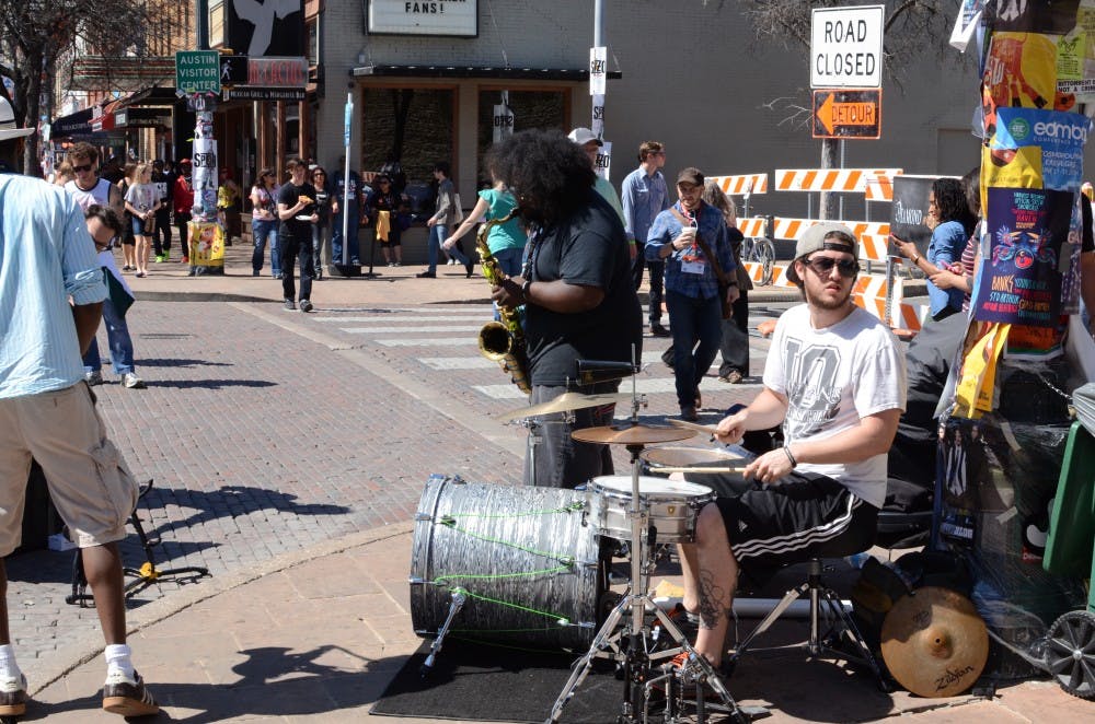 	<p>Street performers on 6th Street in Austin, Texas during the 2014 South By Southwest Music Festival</p>