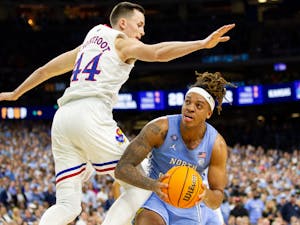 UNC junior forward Armando Bacot (5) attempts to power by a defender during the NCAA championship game against Kansas in New Orleans on Monday, April 4, 2022. UNC lost  72-69.