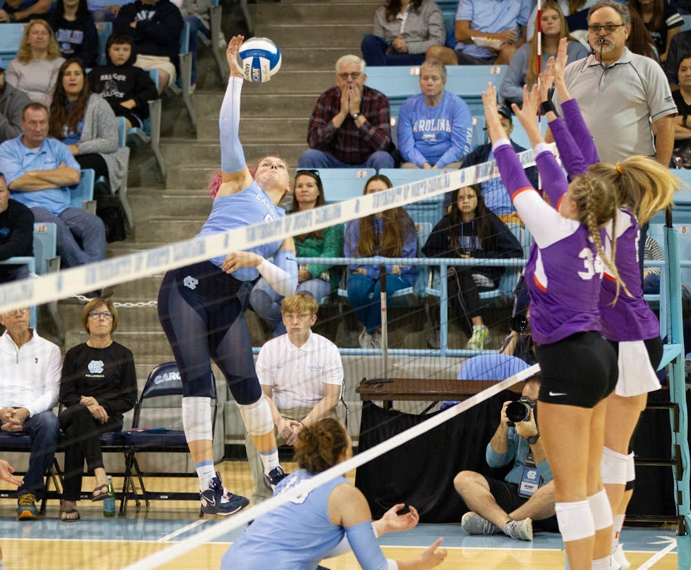 Sophmore Mabrey Shaffmaster (9) slams the ball on Sunday, Oct. 30, 2022, at Carmicheal Arena. The Tar Heels won the match 3-1.