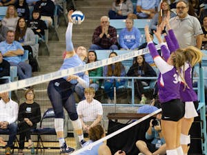 Sophmore Mabrey Shaffmaster (9) slams the ball on Sunday, Oct. 30, 2022, at Carmicheal Arena. The Tar Heels won the match 3-1.