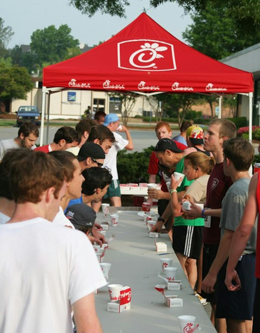 Participants in the Chick-fil-A Challenge attempt to finish eating twelve chicken nuggets. DTH/ Zact Gutterman