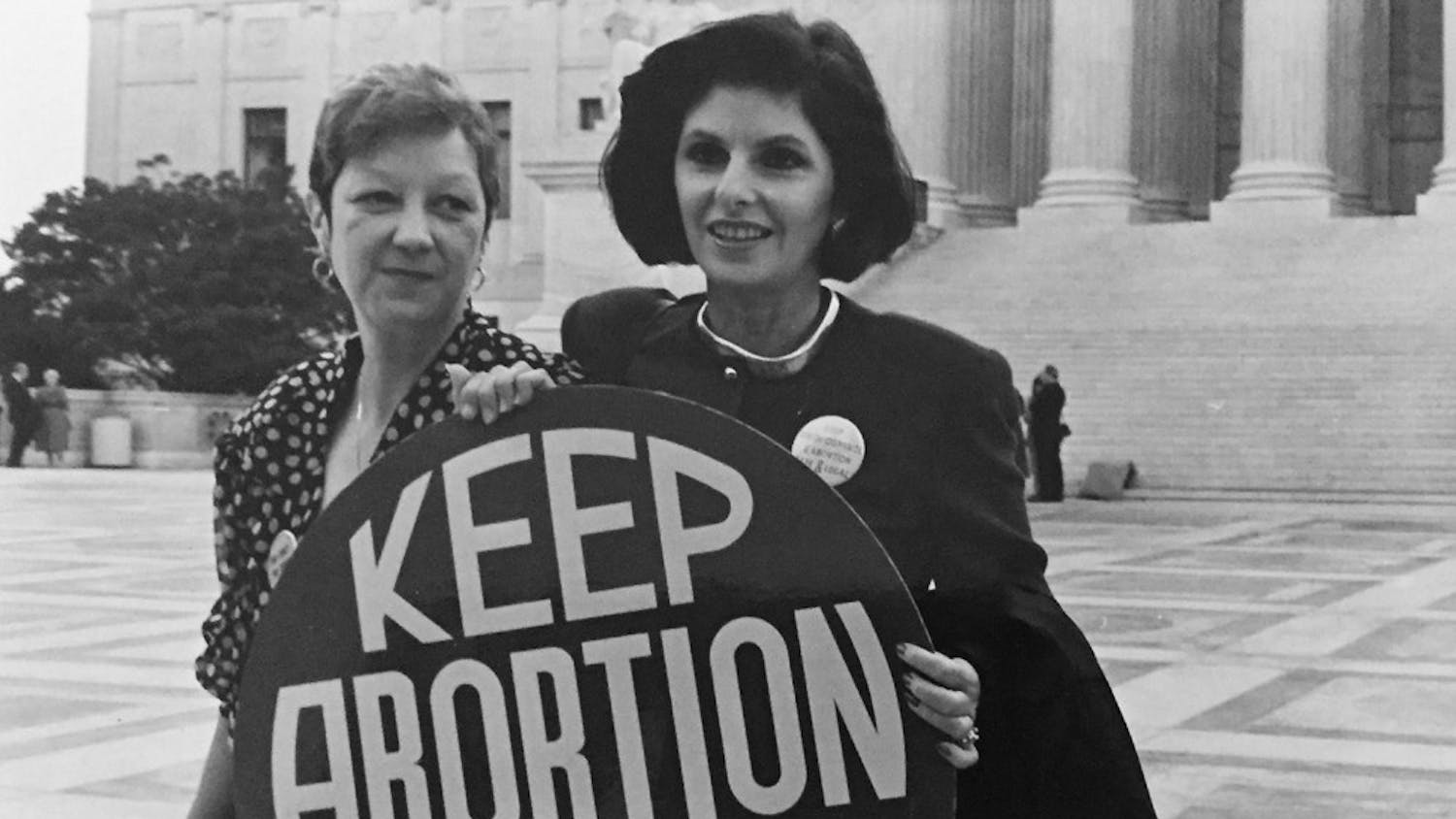 Norma McCorvey (left), the plaintiff of Roe v. Wade, died at age 69. Here,&nbsp;McCorvey (Jane Roe) and her lawyer Gloria Allfred stand&nbsp;on the steps of the Supreme Court, 1989. Photo courtesy of&nbsp;Lorie Shaull.&nbsp;