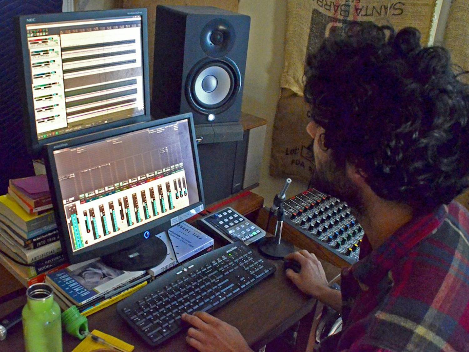 Owner Saman Khoujinian mixes sound in the control room at Sleepy Cat Studios in Carrboro.