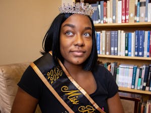Reana Johnson, a senior communications major, poses with her crown and sash in Ullman Library on Tuesday, Jan. 14, 2020. Johnson was crowned Miss Black and Gold 2019-2020 by Alpha Phi Alpha Fraternity Inc. Mu Zeta Chapter.