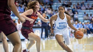Sophomore guard Deja Kelly (25) dribbles the ball to the basket during the game against Virginia Tech at Carmichael Arena on Jan. 9th, 2022.