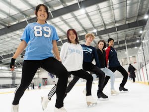 Members of the UNC Figure Skating Club pose for a portrait at the Wake Competition Center in Cary, N.C. on Wednesday, Feb. 23, 2022. The club organizes practices for skaters of all levels and holds public skates on Fridays.