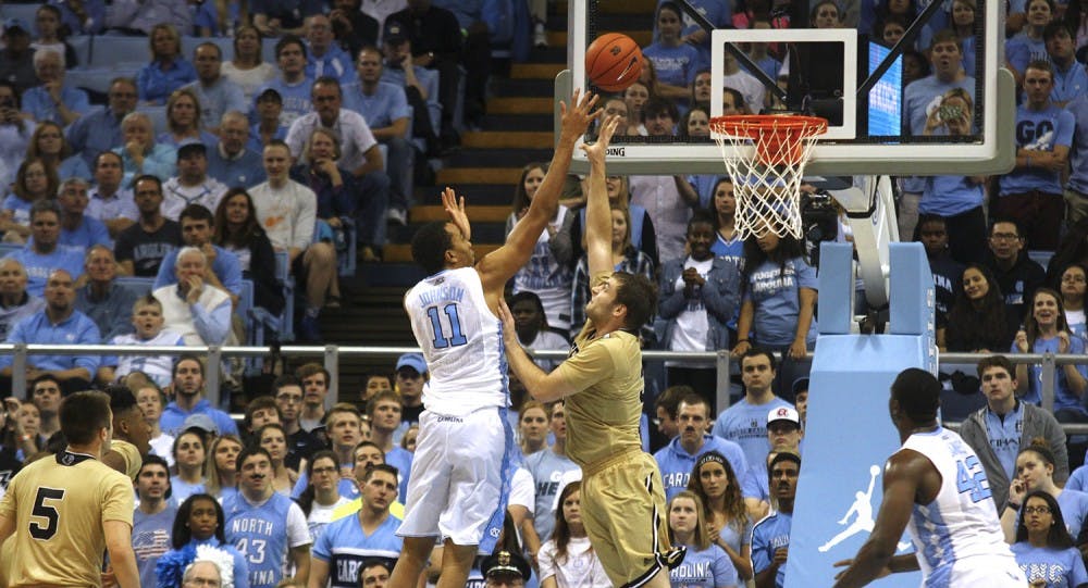 Brice Johnson (11) scores over a Wofford player Wednesday night. The Tar Heels won 78-58.