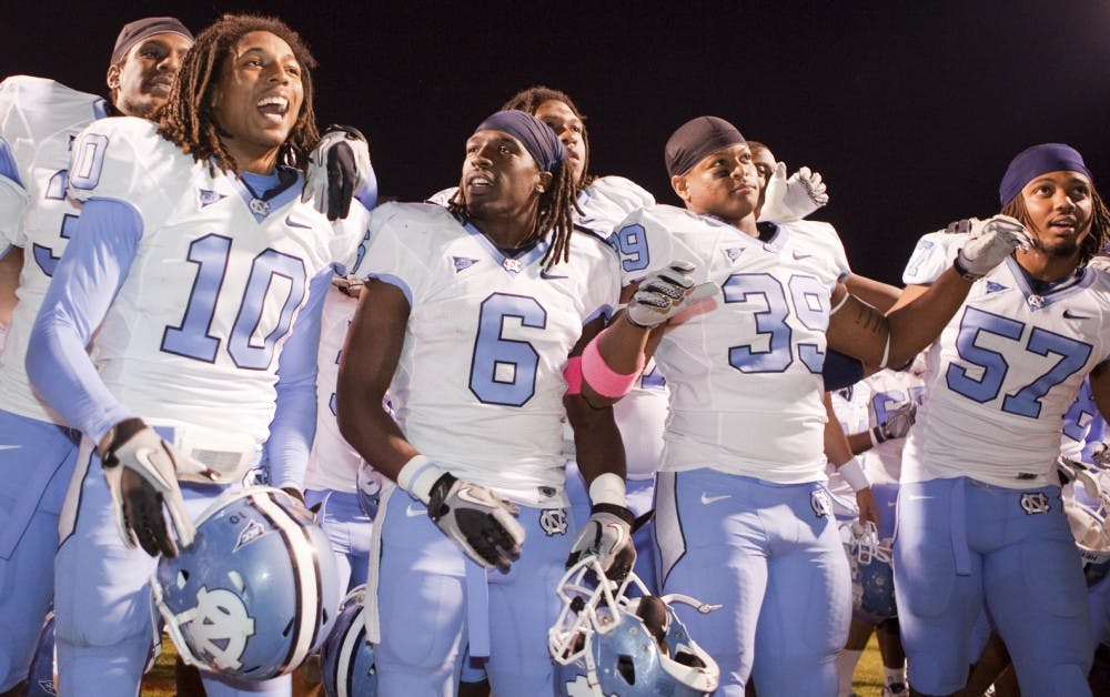 Tre Boston, Anthony Elzy, Kenny owens and dion guy celebrate North Carolina’s 44-10 victory at Virginia. The Tar Heels intercepted five UVa. passes and had just one turnover.