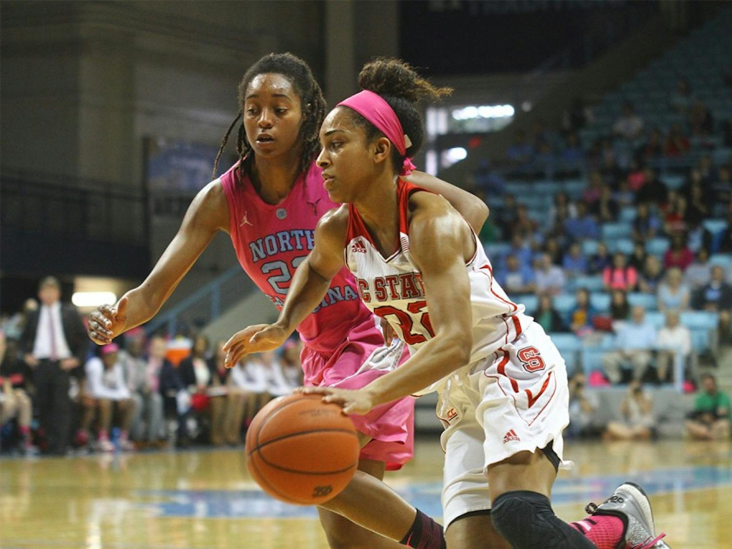 Senior guard N’Dea Bryant (22) defends Dominique  Wilson (right) during the game against NC State on Sunday.