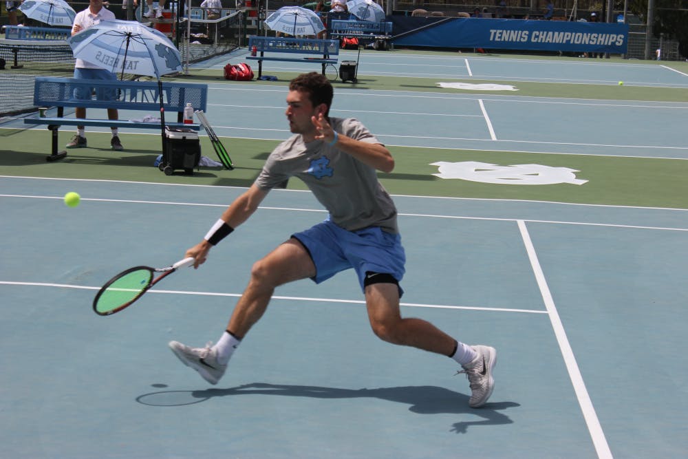 <p>Sophomore Will Blumberg returns a serve against his Georgia Tech opponent on April 14 at the Cone-Kenfield Tennis Center.</p>