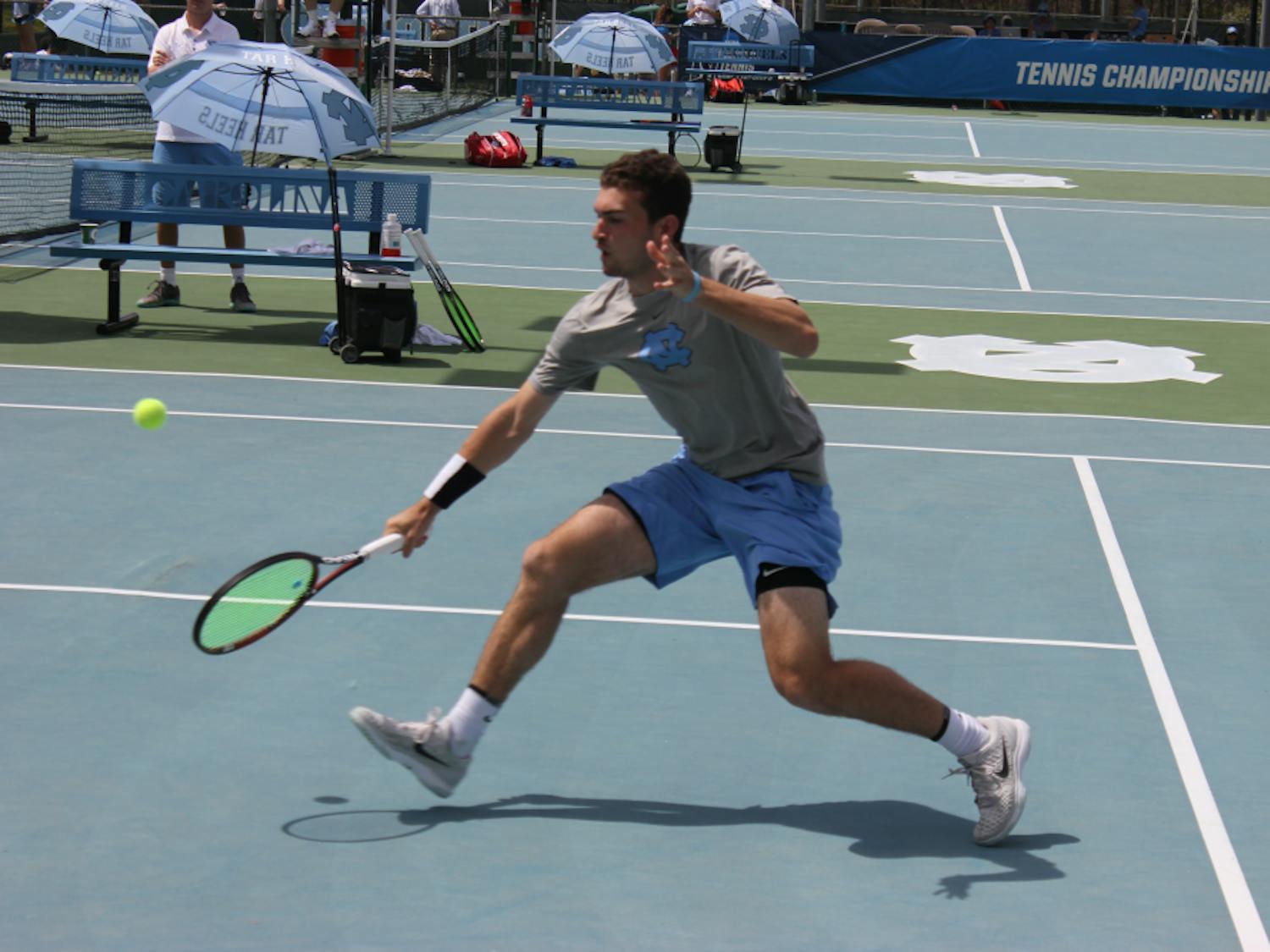 Sophomore Will Blumberg returns a serve against his Georgia Tech opponent on April 14 at the Cone-Kenfield Tennis Center.