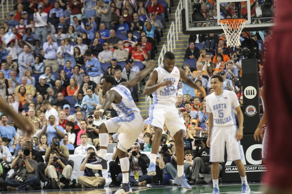 	PJ Hairston and Reggie Bullock celebrate after a 3-pointer by Hairston. Hairston scored a game high 21 points and was an effective 5-for-6 from beyond the arc.