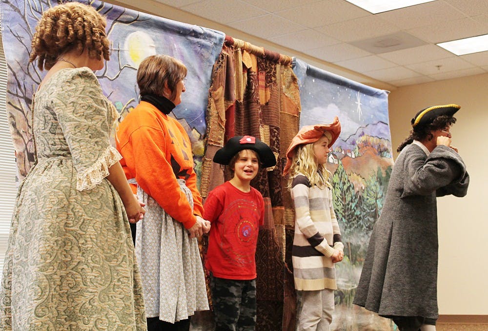 On Tuesday, October 30th, the Bright Star Theater company, from Asheville, NC, performed their rendition of the "Legend of Sleepy Hollow" at the Orange County Public Library in Hillsborough for an audience of young children and their parents. During the performance, the actors invited two children, Eli Aquino, 8 years old and a student at Cameron Park Elementary, and Hattie Bendall, 9 years old and a student at McDougle Elementary, to join them singing on stage. 
