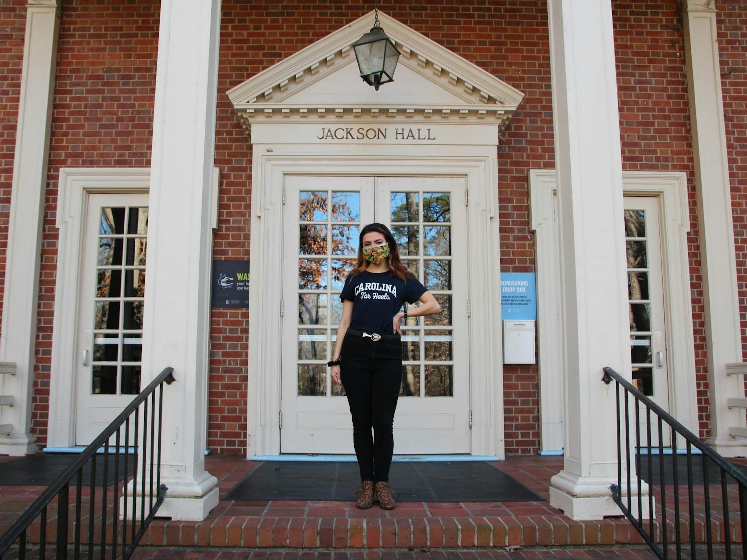 Admissions Ambassador Gabriela Duncan poses for a portrait outside of Jackson Hall on Feb. 17, 2021. Duncan gives virtual tours of the UNC campus to prospective students.